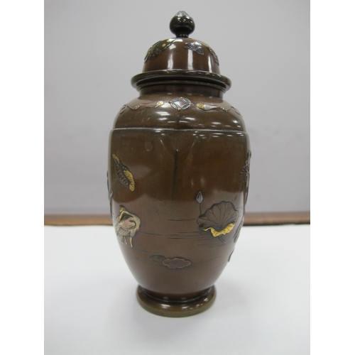 1083 - A Late XIX Century Japanese Bronze Vase and Cover, of hexagonal form overlaid with cranes in shallow... 