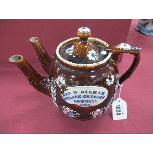 1024 - A Mid XIX Century Barge Ware Pottery Double Spouted Teapot and Cover, the brown glaze applied with f... 