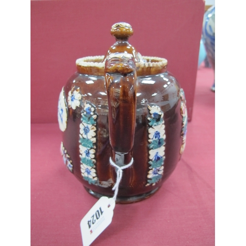 1024 - A Mid XIX Century Barge Ware Pottery Double Spouted Teapot and Cover, the brown glaze applied with f... 