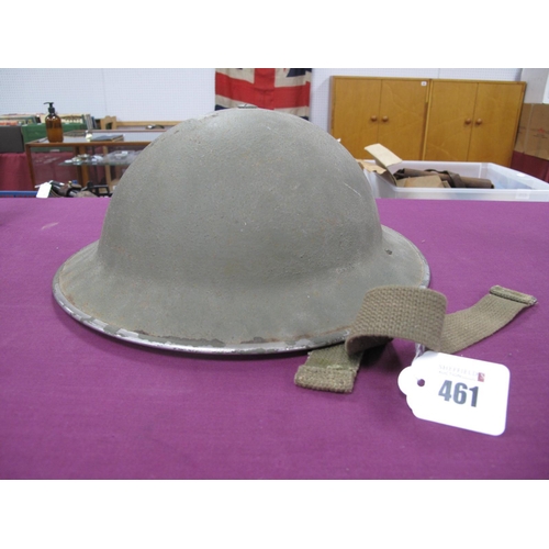 461 - WWII British Brodie Helmet, with liner and chin strip, helmet has manufacturer marks and dated 1942.