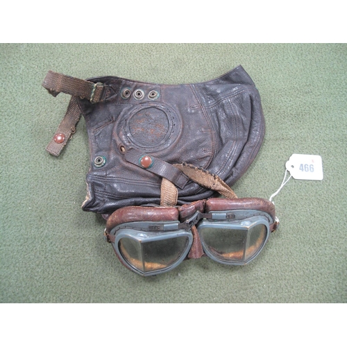 466 - A WWII RAF Leather Flying Helmet, with attached googles, overall good condition, age related wear th... 