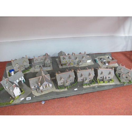 333 - A 'OO' Gauge Street Diorama, including housing, village stores, public house, lamp posts, people, ca... 