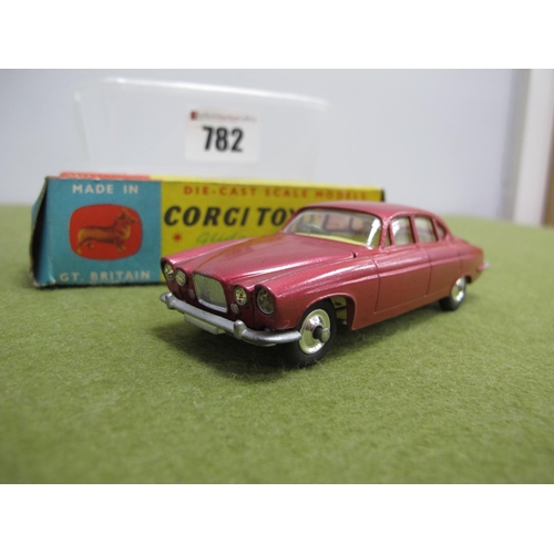 782 - A Boxed Corgi No. 258 Diecast Model Jaguar Mark X, metallic cerise body, with lemon interior, luggag... 