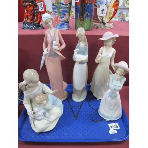 1226 - Lladro Figure of Young Girls with Kitten, four Nao figures. (5)