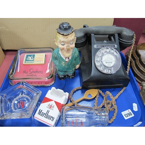 1390 - A Circa 1930's Oak Smokers Stand, stepped base, with a tray of smoking memorabilia, telephone, etc.