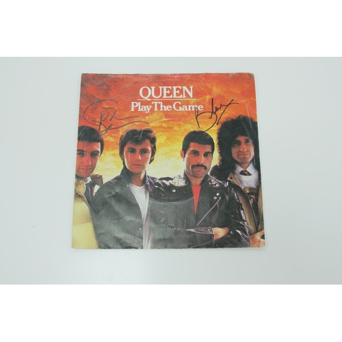 1441 - Queen Autographs, Brian May and John Deacon, ink signed (unverified) on the cover of a Play The Game... 