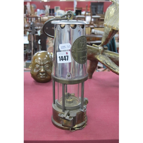 1447 - A Eccles Miners Lamp, 24cm high with handle down.