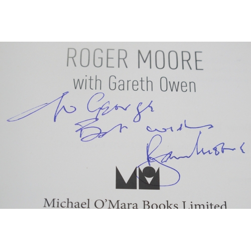 1407 - James Bond, Roger Moore Autograph, ink signed (unverified) on a Bond on Bond book.