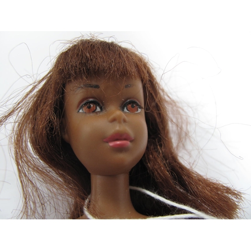 762 - A Black Francie Doll, slight loss of paint on eyebrow, outfit playworn, marked 1966 Mattel Made in J... 