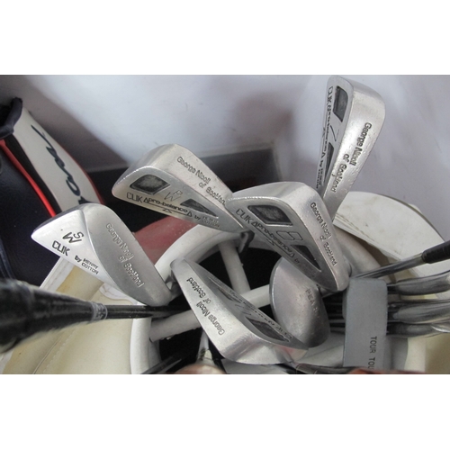 1128 - Golf Clubs: Radial, Adams, Mizuro, Dunlop, George Nicoll, Aldridge, many others, in two carry bags.