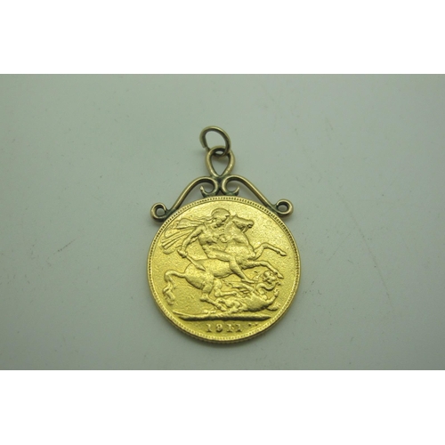 595 - 1911 George V Gold Sovereign, in a soldered mount, total weight 8.5grams.