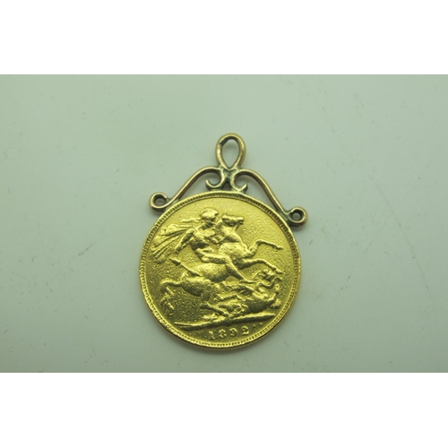 596 - 1892 Victoria Gold Sovereign, in a soldered mount, total weight 8.3grams.