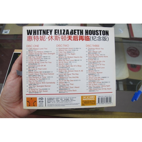 145 - Two Unusual CD's, first being Whitney Houston - The Queens Returns, dated 2012, three C.D Best of Co... 