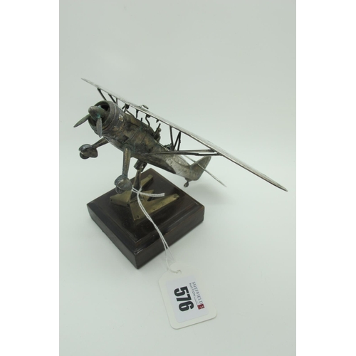 576 - A Novelty Model Aeroplane, articulated, stamped 