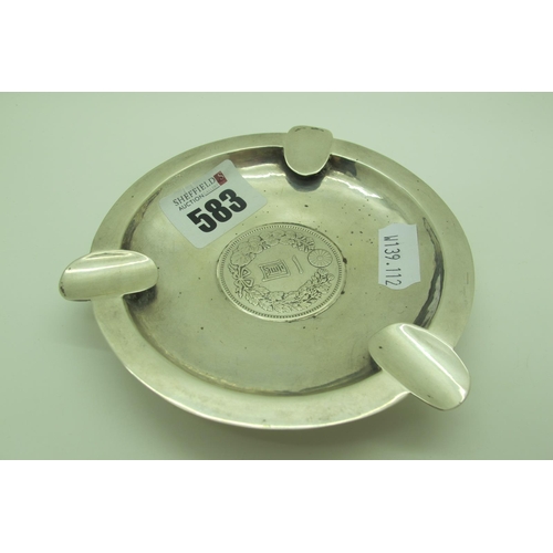 583 - A Japanese Ashtray, of circular form with three rests, inset to the centre with a 416 One Yen 900 co... 