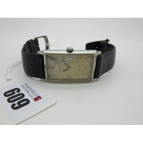 609 - Omega; A Vintage De Ville Gent's Wristwatch, the signed rectangular dial with line markers, the move... 