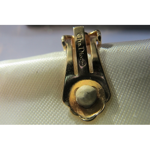 627 - Christian Dior; A Curb Link Necklace, with central rectangular cluster, clasp stamped 