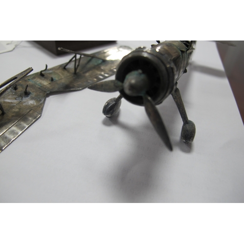 576 - A Novelty Model Aeroplane, articulated, stamped 