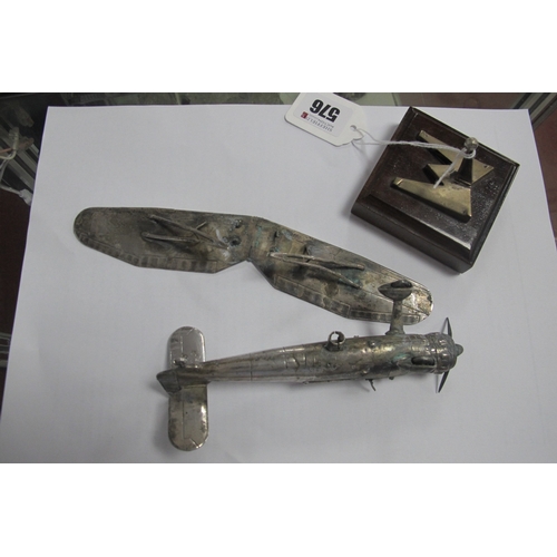 576 - A Novelty Model Aeroplane, articulated, stamped 