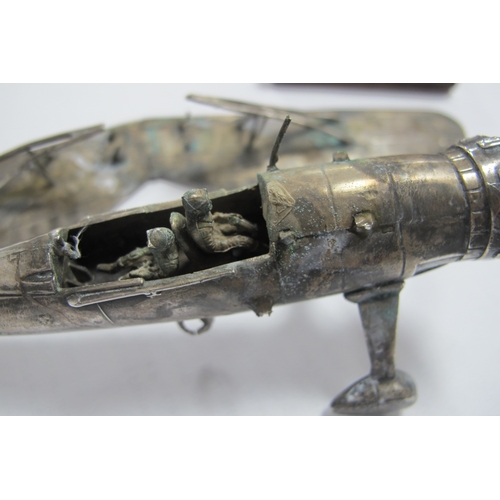 576 - A Novelty Model Aeroplane, articulated, stamped 