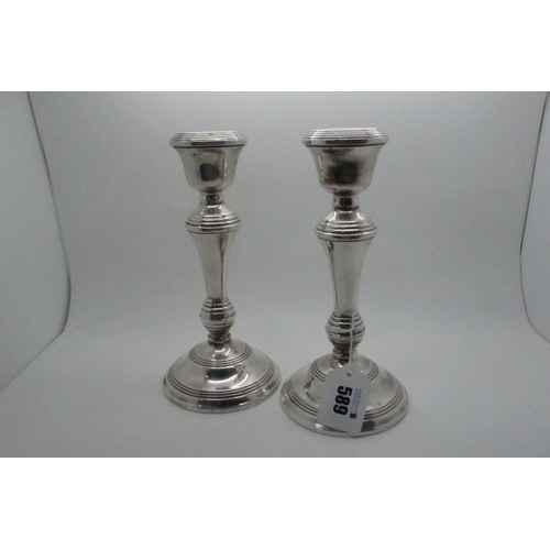 589 - A Pair of Hallmarked Silver Candlesticks, B&Co, Birmingham 1969, with reeded detail on circular spre... 