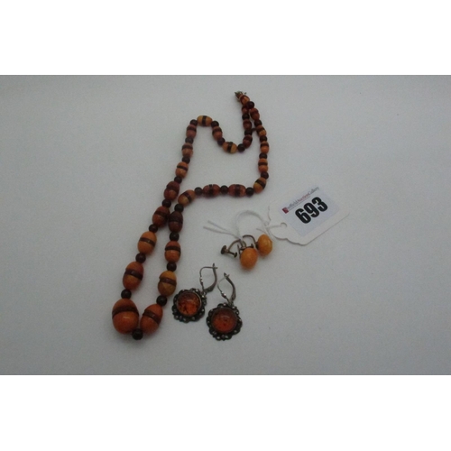 693 - A Vintage Amber Coloured Bead Necklace, of graduated alternate design, together with a pair of amber... 