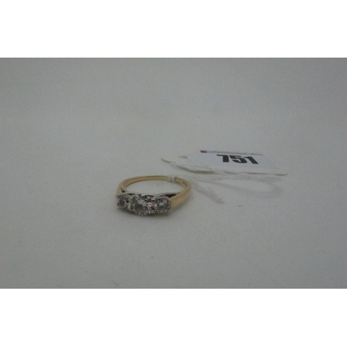 751 - A Three Stone Diamond Ring, the (5.5mm) brilliant cut stone claw set between two smaller brilliant c... 