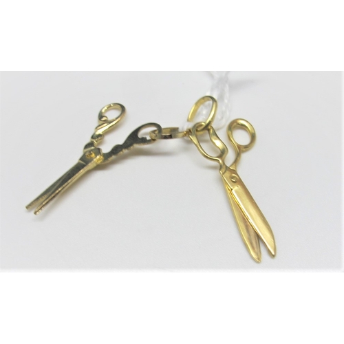 681A - Charm Pendants - two pairs of articulated scissors, stamped 