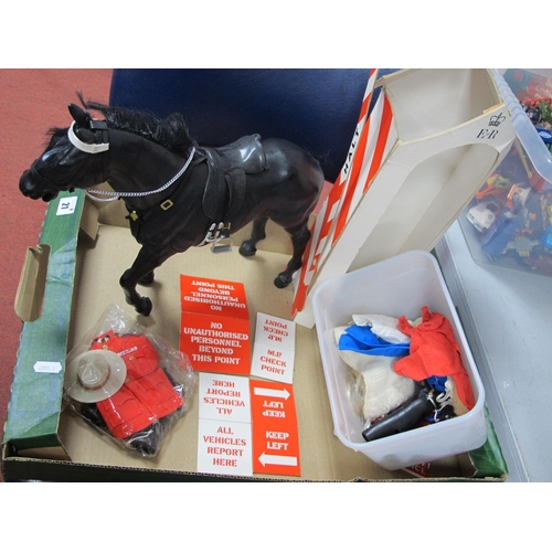 21 - A Vintage Palitoy Action Man Black Horse, with saddle and tack, The Royal Canadian mounted police un... 