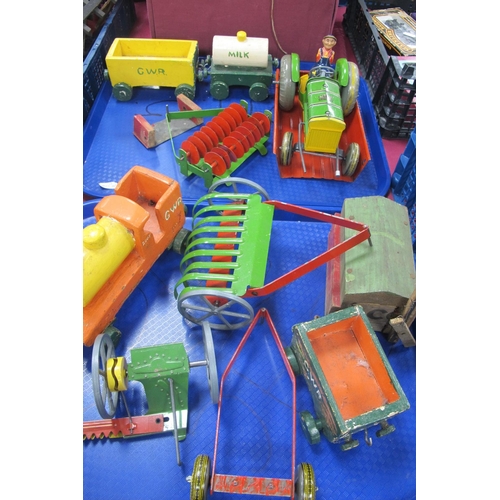 453 - A Mid XX Century Tinplate Mettoy Tractor and Implement Set, plus driver; together with a handmade wo... 