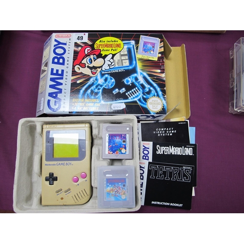 49 - A Boxed Nintendo Game Boy Compact Video Game System, front screen fascia detached (held in place wit... 