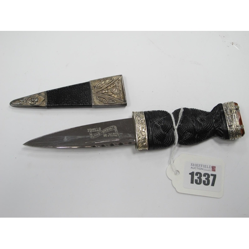 1337 - Nowill of Sheffield Skean Dhu Boot Knife, with jewel set, carved hilt, with sheath 18.5cm long.