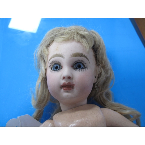 94 - A Bebe Jumeau Bisque head doll (Paris, France), with fixed blue glass eyes, painted lashes and brows... 