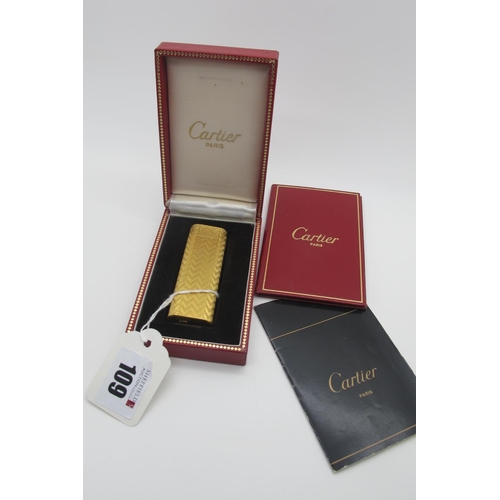109 - Cartier; A Gold Plated Lighter, allover textured finish, stamped 