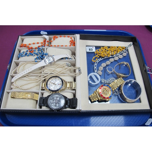 83 - Ladies and Gent's Wristwatches, together with a wide hallmarked silver hinged bangle, leaf scroll en... 