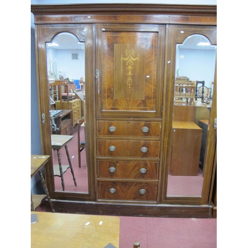 1629 - An Edwardian Inlaid Mahogany Triple Wardrobe, with stepped pediment, mirror doors, to hanging compar... 