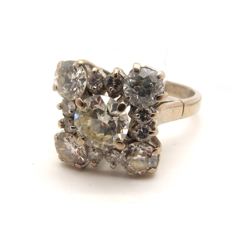 112 - A Large Diamond Cluster Cocktail Ring, of square design, claw set throughout with brilliant cut diam... 