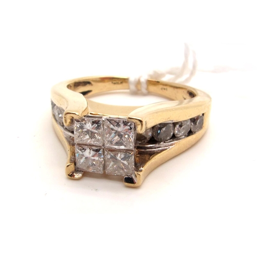 113 - A Modern Princess Cut Four Stone Diamond Ring, corner set high above brilliant cut diamond channel s... 