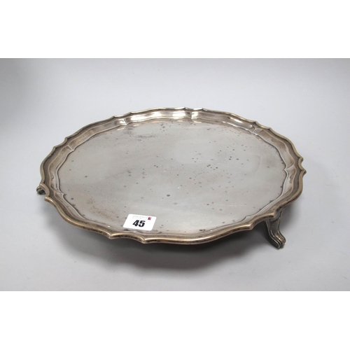 45 - A Hallmarked Silver Salver, CB&S, Sheffield 1944, of plain shaped circular form, raised on three pad... 