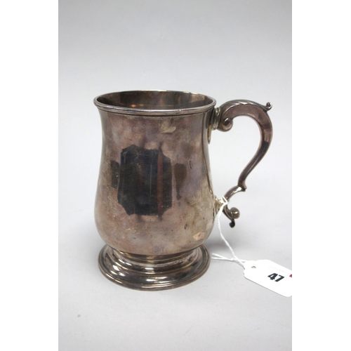 47 - A Georgian Hallmarked Silver Mug, T.W, London 1772, of plain baluster form with leaf capped scroll h... 