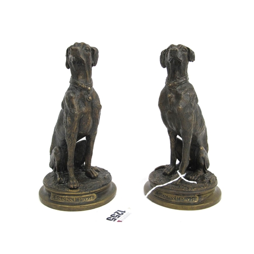 1255 - AFTER F. SOUCHAL (Paris) A Pair of Bronzed Models of Greyhounds, upon circular bases inscribed 