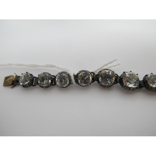 108 - A XIX Century Colourless Paste Set Line Bracelet, the graduated cushion shape colourless paste colle... 