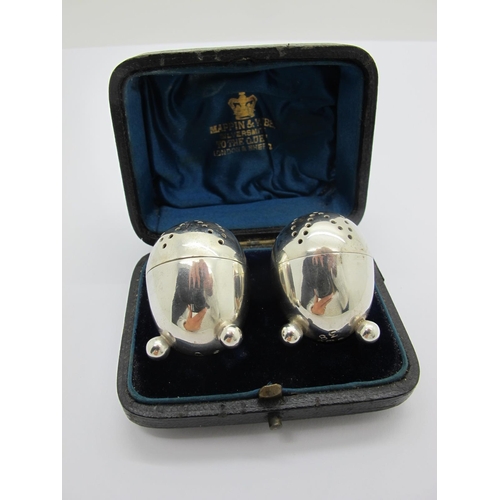 100 - A Pair of Victorian Hallmarked Silver Pepperettes, Sheffield 1891, each of egg form on three ball fe... 