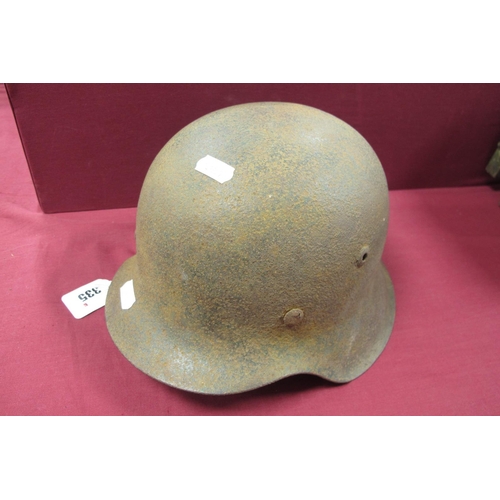 335 - WWII German Combat Helmet, in good relic condition with bales and liner band. Plus remains of origin... 