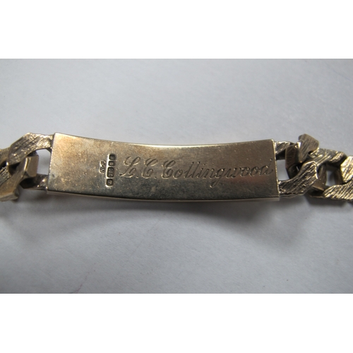 229 - A 9ct Gold Identity Bracelet, composed of polished and textured links, inscribed 