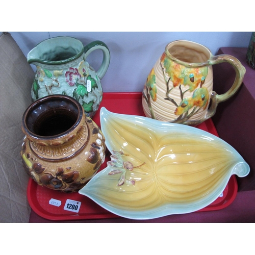 1200 - A Carlton Ware Ribbed and Leaf Moulded Jug, with twig handle, Radford leaf and flower mottled jug, a... 