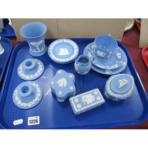 1226 - A Collection of Wedgwood Blue Jasperware, tea cup, saucer, candlesticks, trinket boxes:- OneTray