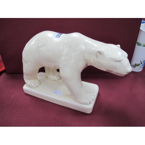 1235 - A 1930's Beswick Cream Pottery Polar Bear, satin glaze, on square base, chip to one corner 16cm high... 