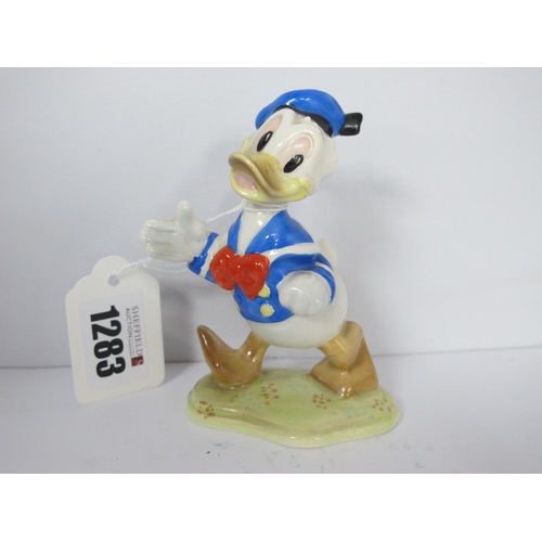 1283 - A Beswick Walt Disney Figure of Donald Duck, with gold oval back stamp, 10cm high.