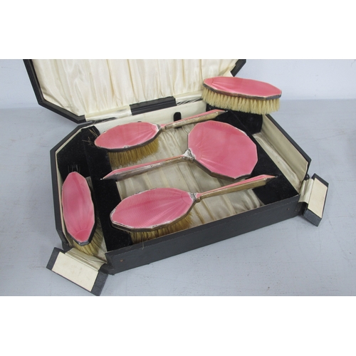 32 - A Hallmarked Silver and Pink Enamel Five Piece Dressing Table Set, DM Co, Birmingham 1931, (damages ... 